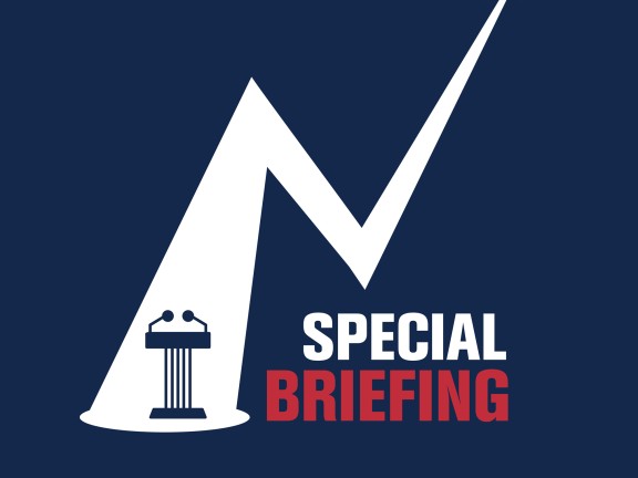 Title special briefing with a podium under a spotlight