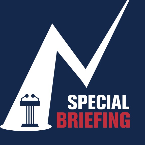 Title special briefing with a podium under a spotlight