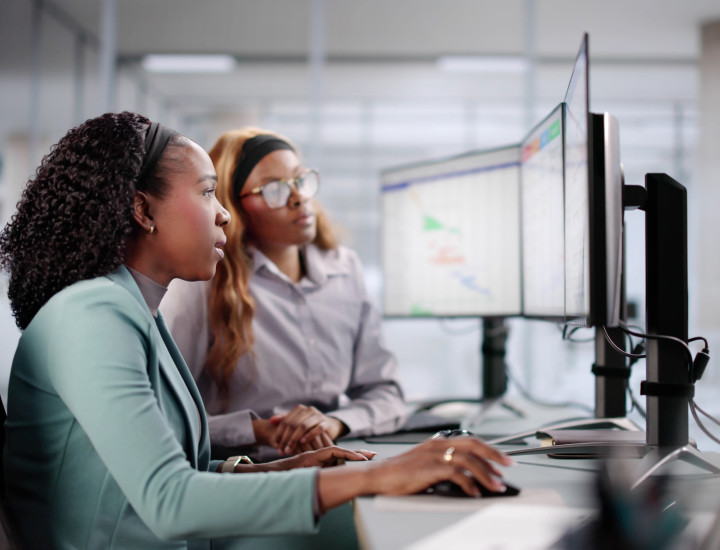 Internship, intern working and supervisor looking on